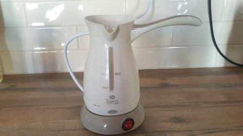 a white blender sitting on top of a table at Christos Katerina House in Pythagoreio