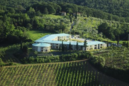 an aerial view of a house in a vineyard at Chianti Village Morrocco in Tavarnelle in Val di Pesa