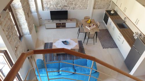an overhead view of a kitchen and a living room at Christos Katerina House in Pythagoreio