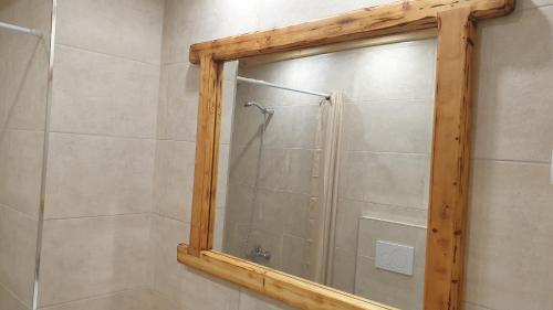 a bathroom with a shower with a mirror at Christos Katerina House in Pythagoreio