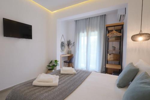 a bedroom with a bed with two pillows on it at Heliotopos in Skala Eresou