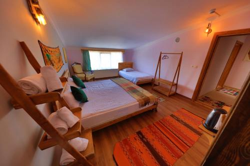 a bedroom with a bunk bed with a ladder at Alphan Cappadocia in Uchisar