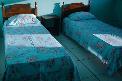 Llit o llits en una habitació de Pousada Guarida