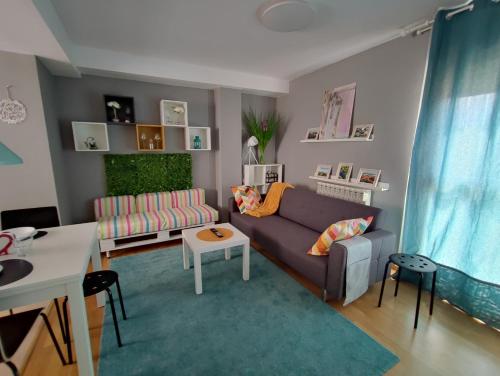 a living room with a couch and a table at El Mirador de Murillo in Murillo de Río Leza