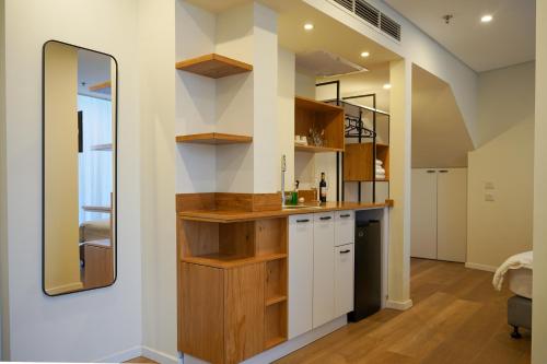 a bathroom with a sink and a mirror at Urbanic Hotel in Jerusalem