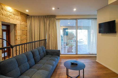 TV a/nebo společenská místnost v ubytování Urbanic Hotel