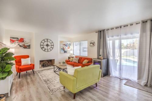 a living room with a couch and chairs and a fireplace at Hidden Gem in the Desert -Gym/Pool/Spa/Games-4BR in Spring Valley