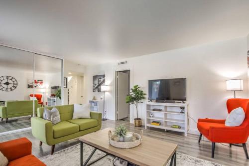 a living room with a couch and chairs and a tv at Hidden Gem in the Desert -Gym/Pool/Spa/Games-4BR in Spring Valley