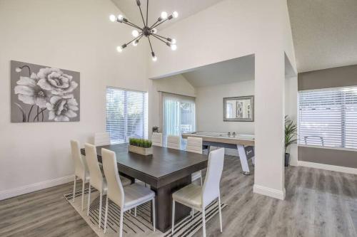 a dining room with a table and chairs at Hidden Gem in the Desert -Gym/Pool/Spa/Games-4BR in Spring Valley