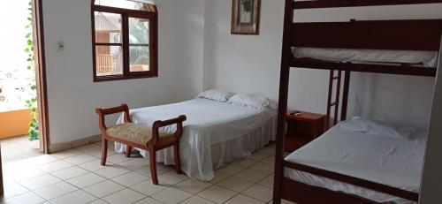 En eller flere senge i et værelse på Hotel Piedra del Mar