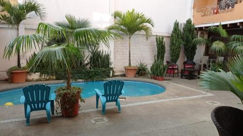 Swimmingpoolen hos eller tæt på Hotel Piedra del Mar