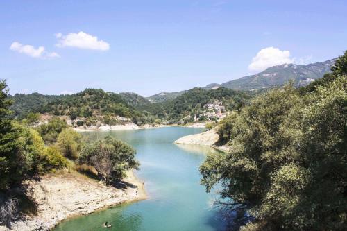 a view of a river with mountains in the background at Casa Vacanze Antico Poggio in Poggio San Giovanni