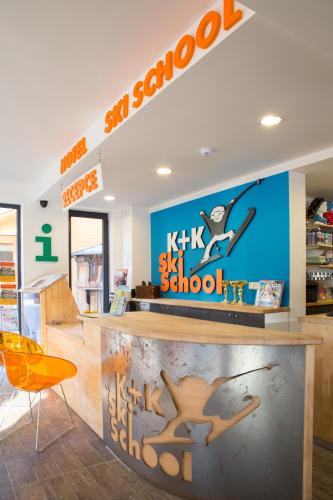 a store with a sign for a skate school at Hotel U Kabinky in Janske Lazne