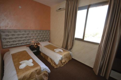 מיטה או מיטות בחדר ב-New Metropole Hotel - Jerusalem
