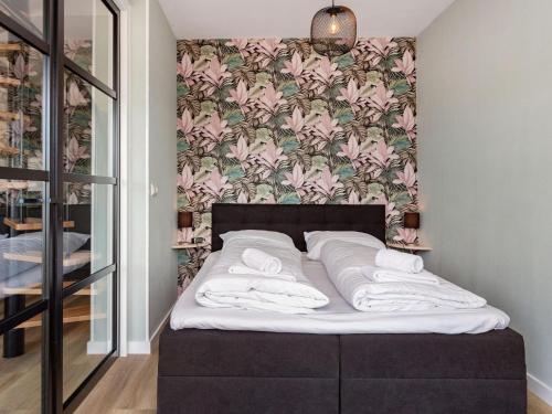 Ένα ή περισσότερα κρεβάτια σε δωμάτιο στο Apartment near Sneekermeer water sports