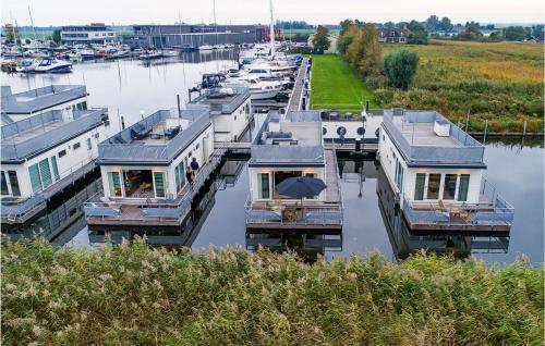 a group of boats parked in a marina at Awesome Ship In Aalsmeer With Lake View in Aalsmeer
