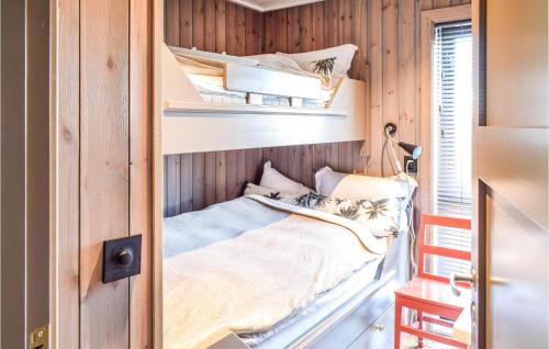 a small bedroom with a bunk bed in a house at Cozy Home In Sjusjen With Sauna in Sjusjøen