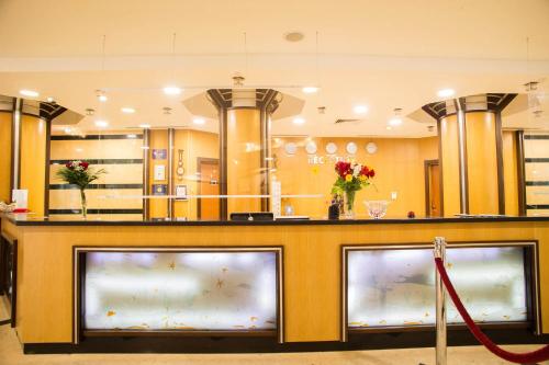 a store with a large counter with three fish tanks at Emerald Beach Resort & Spa in Ravda