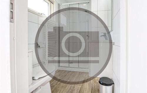 a bathroom with a shower with a round mirror at Stunning Ship In Aalsmeer With Kitchen in Aalsmeer