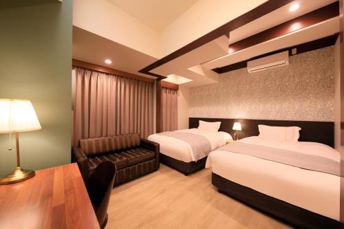 Ένα ή περισσότερα κρεβάτια σε δωμάτιο στο Centurion Hotel Residential Akasaka Station