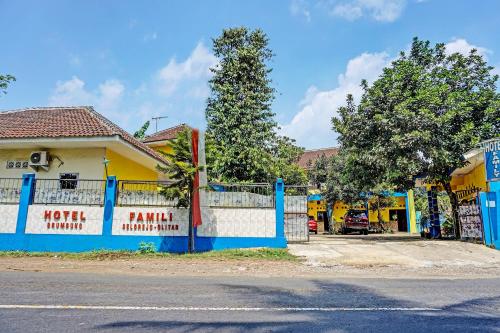 a blue and white fence in front of a house at OYO 91573 Hotel Family Blitar in Blitar