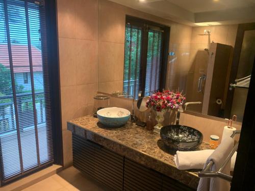 a bathroom with a counter with a sink and a mirror at Samui Dreams Seaview Villa - Bangrak Beach - with Private Pool in Koh Samui 