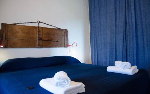 two towels on a bed in a room at Country Home Lonato in Lonato del Garda