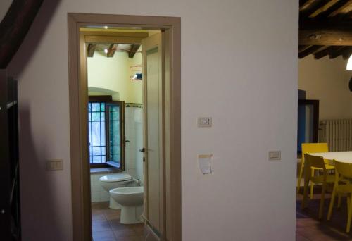 a bathroom with a toilet and a sink at Country Home Lonato in Lonato del Garda