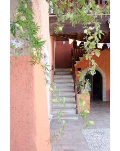 a stairway leading up to a building with stairs at Country Home Lonato in Lonato del Garda