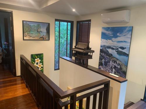 a staircase in a house with a painting on the wall at Samui Dreams Seaview Villa - Bangrak Beach - with Private Pool in Koh Samui 