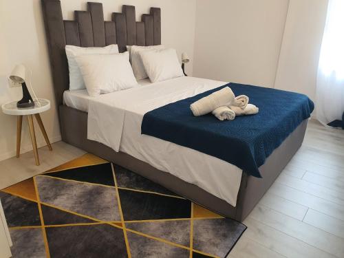 Voodi või voodid majutusasutuse Grey Residence Apartments toas