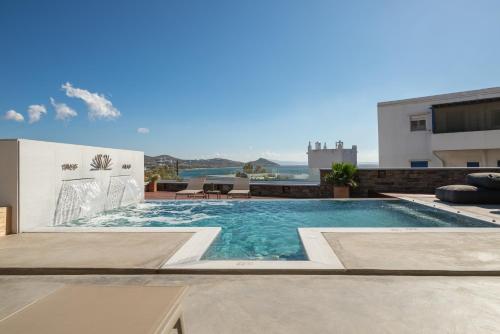 a swimming pool on top of a building at Coocono Villas in Tinos