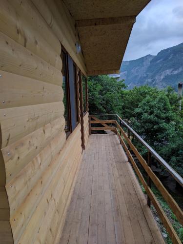 a wooden walkway on the side of a building at Old Halidzor in Halidzor