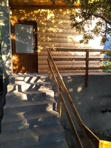a stairway leading to the door of a cabin at Old Halidzor in Halidzor