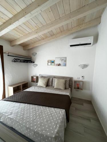 Uma cama ou camas num quarto em Casa vacanze residenza del sole