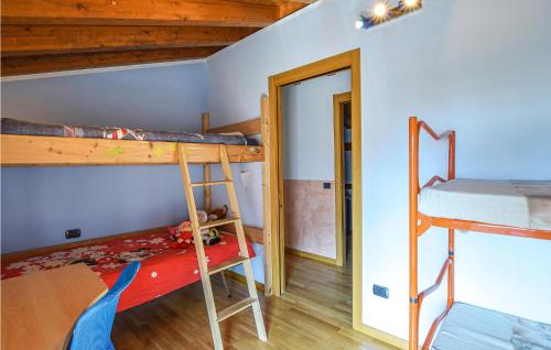 a bedroom with two bunk beds and a doorway at 4 Bedroom Amazing Home In Pilzone-Iseo in Pilzone