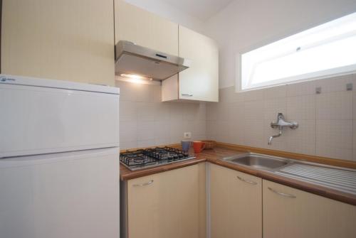 Kuchyň nebo kuchyňský kout v ubytování Residence Villa Morcone