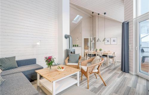 a living room with a couch and a table at Beautiful Home In Krems Iiwarderbrück in Göls