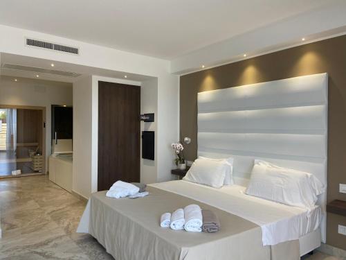 a bedroom with two beds with white pillows at Il Poggio in Ascoli Piceno