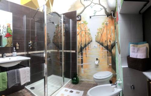 a bathroom with a shower with a painting on the wall at La Vista in Calitri