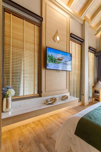 W1Bangkoknoi Hotelにあるテレビまたはエンターテインメントセンター