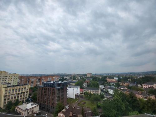 a city with buildings and a cloudy sky at PRESTIGE-GOLD in Rivne