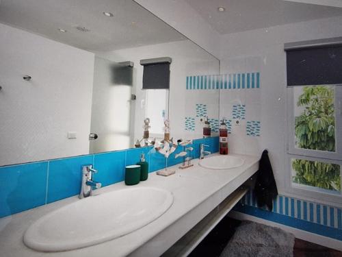 a bathroom with two sinks and two mirrors at UNIQUE MODERN HOUSE MALAGA - PASEO MARITIMO/CENTER in Málaga