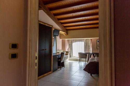 a hallway with a living room and a dining room at B&B Acireale - Il Cavalluccio Marino Fronte Mare in Acireale