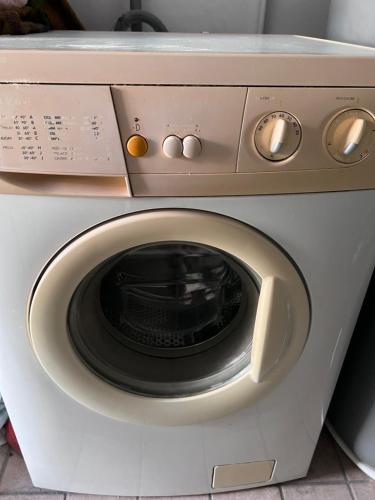 a close up of a washing machine at Stea monolocale loft in villa in Sommariva del Bosco