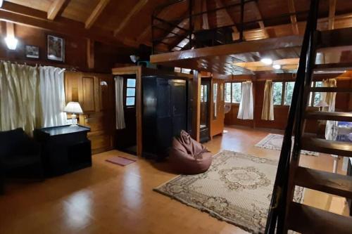 a living room with a couch and a rug at An adorable, spacious, quiet and comfy WFH space in Carmona