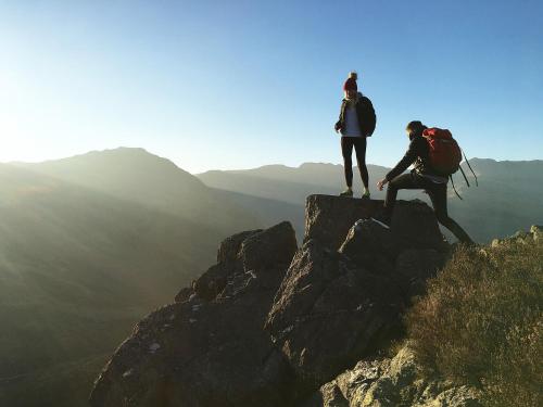 two people standing on the top of a mountain at Canny Brow Barn in Kendal