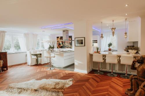 a living room with a kitchen and a dining room at LUXURY PENTHOUSE ☆ ☆ ☆ ☆ ☆ in Cologne