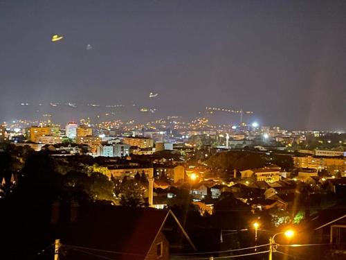 a view of a city at night with lights at Apartman Ela in Banja Luka