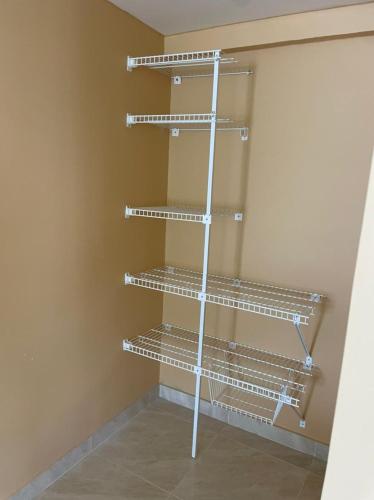 a empty closet with metal shelves in a room at Posada Miss Portia in Providencia